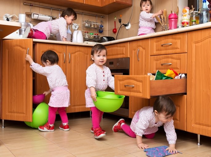 Little girl playing in the kitchen
