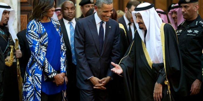 President Barack Obama and First Lady Michelle Obama walk with King Salman bin Abdulaziz of Saudi Arabia at Erga Palace in Riyadh, Saudi Arabia, Jan. 27, 2015. (Official White House Photo by Pete Souza) This official White House photograph is being made available only for publication by news organizations and/or for personal use printing by the subject(s) of the photograph. The photograph may not be manipulated in any way and may not be used in commercial or political materials, advertisements, emails, products, promotions that in any way suggests approval or endorsement of the President, the First Family, or the White House.