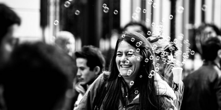 happy woman street bubbles