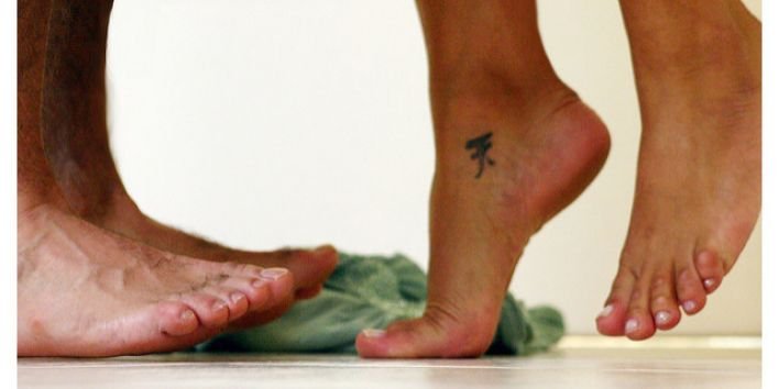 couple love naked feet tattoe