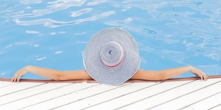 pool luxury woman hat travel